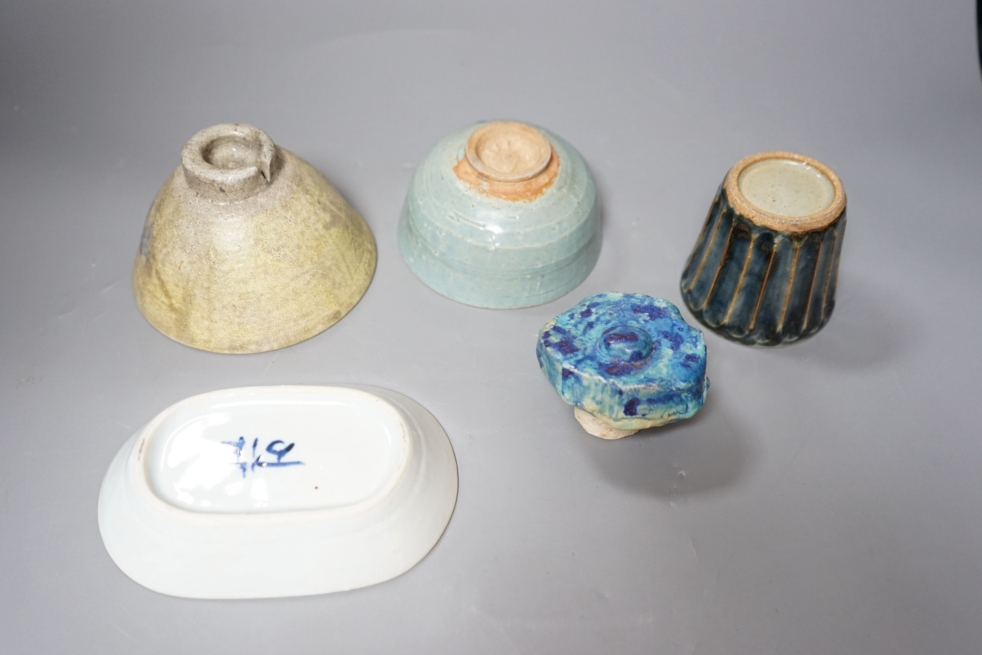 Japanese studio pottery; a group to include two bowls, and a plum dish, a fluted cup and a brushwasher, tallest 8cm, (5)